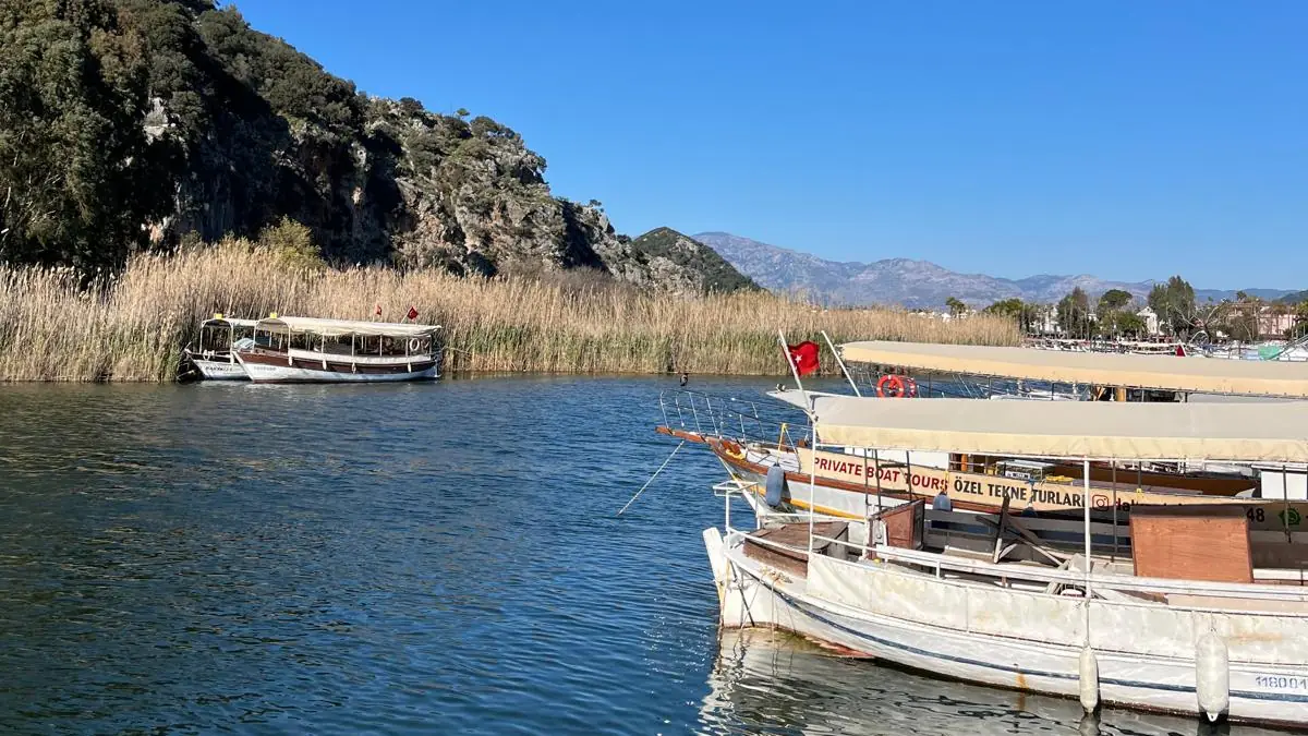 Private boats waiting at the quay in Dalyan Private boats waiting at the quay in Dalyan